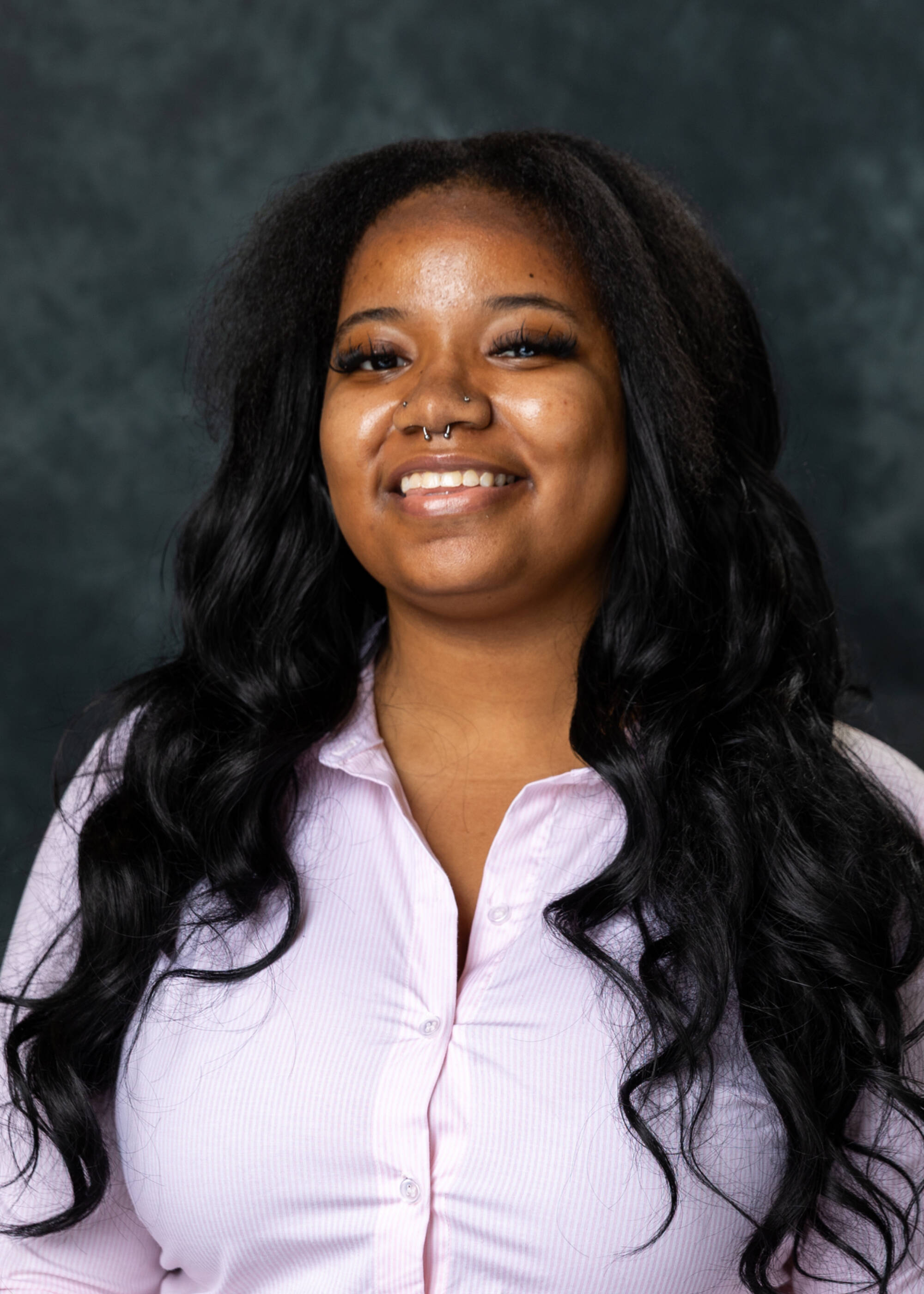 Gabrielle Hosey smiling in a light purple top